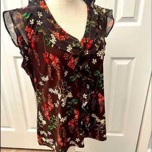 Stretchy top, fall colors, ruffles, floral.  Perfect w slacks/skirt, no iron